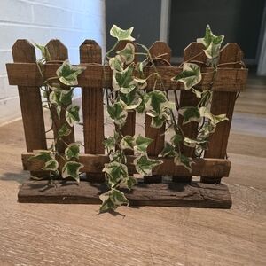 Decorative wooden fence with ivy